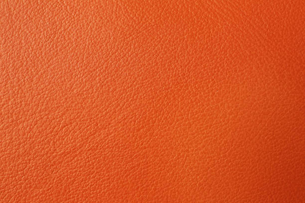 istock Texture of orange leather as background, closeup 1367844198