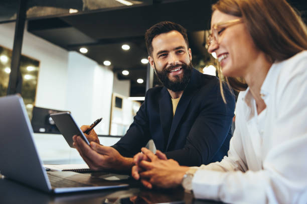 istock Happy entrepreneurs having a discussion in an office 1367844251