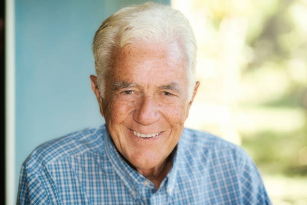 istock Handsome man in his late 70s smiles at the camera 1367844443