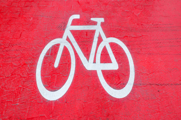 white icon bicycle way at the red asphalt at a main street