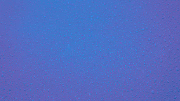istock Drops of water on a lilac background. Very Peri. Copy space 1367848518