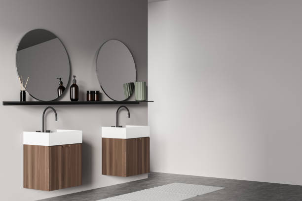 istock White bathroom interior with sinks and mirrors, concrete floor, mockup 1367848559