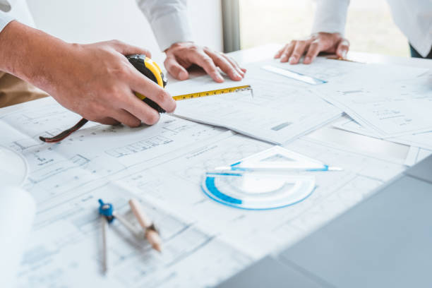 istock Team Engineer drawing graphic planning and meeting for architectural project on workplace 1367851404