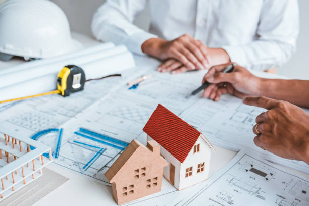 istock Team Engineer drawing graphic planning and meeting for architectural project on workplace 1367851405