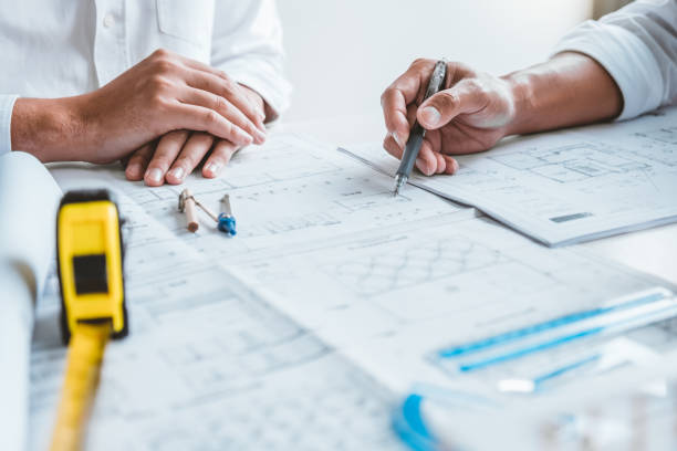 istock Team Engineer drawing graphic planning and meeting for architectural project on workplace 1367851406