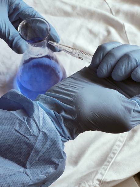 istock Laboratory personnel diluting a chemical compound 1367855605