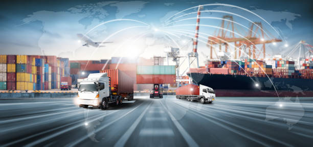 Global business logistics import export and container cargo freight ship loading at port by crane, container handlers, cargo plane, truck on highway, transport industry concept, Depth blur effect stock photo