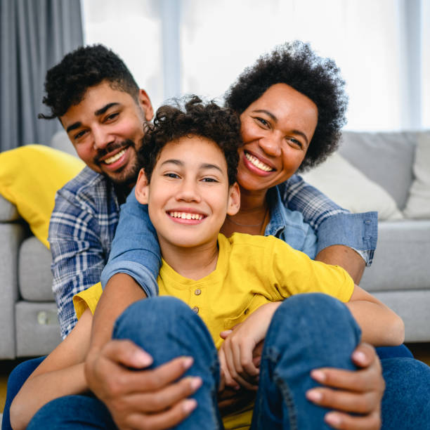 istock Happy black family at home. 1367858618