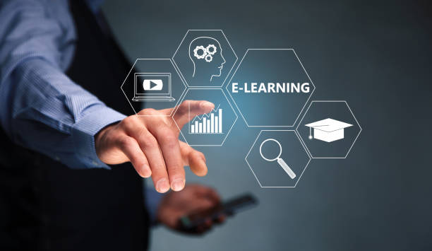 istock businessman holding mobile phone with text learning 1367859396