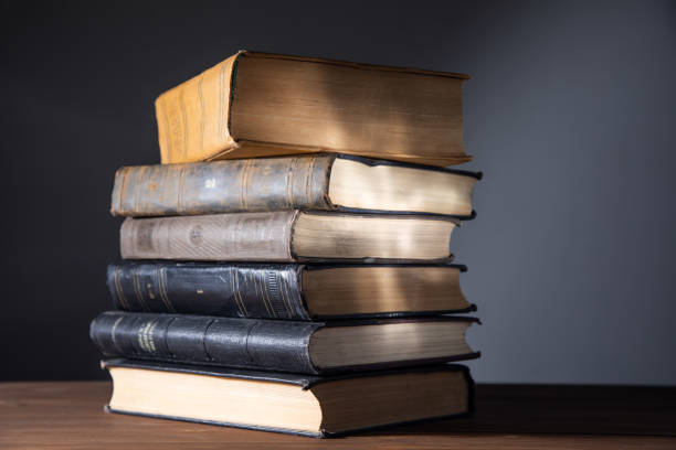 istock group pile books and wooden background 1367859446