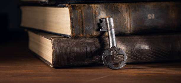 istock old vintage key with books 1367859459