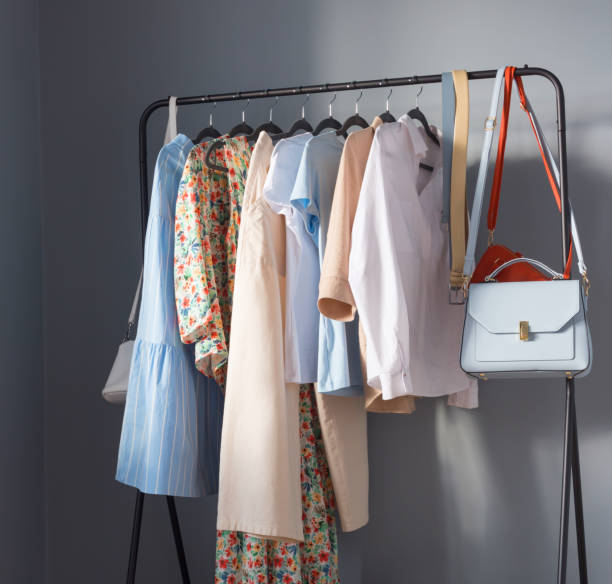 istock light colored womens summer clothes and shoes on  hanger 1367860565