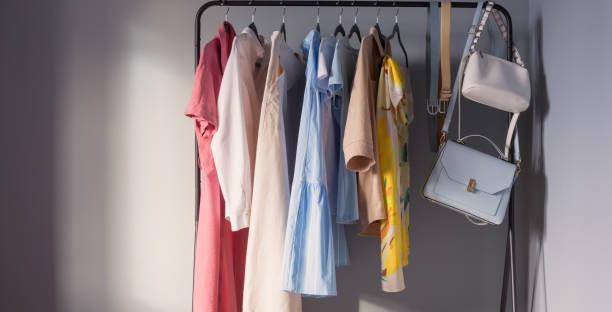 istock light colored womens summer clothes and shoes on  hanger 1367860579