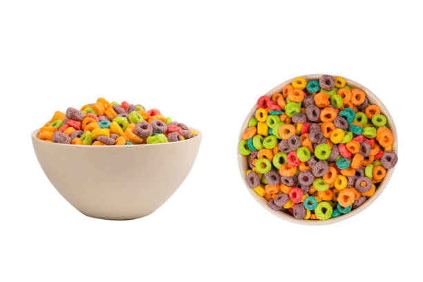 istock Colorful rings cereal spill out into a bowl. Breakfast. Isolated. 1367861756