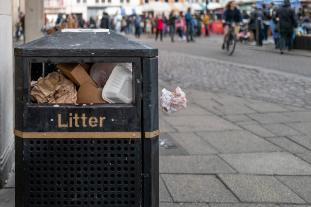 istock Shallow focus of a generic litter bin seen in a busy town centre. 1367862448