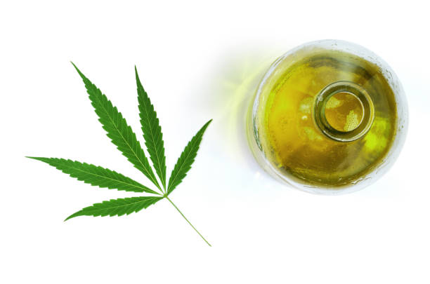istock Hemp oil in a bottle with a cannabis leaf. 1367863110