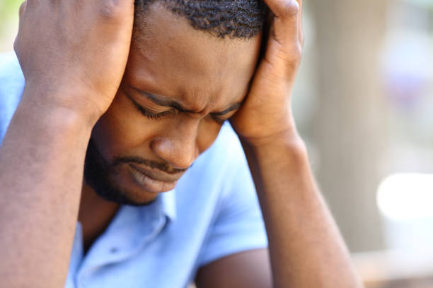 istock Worried man with black skin complaining alone 1367864327