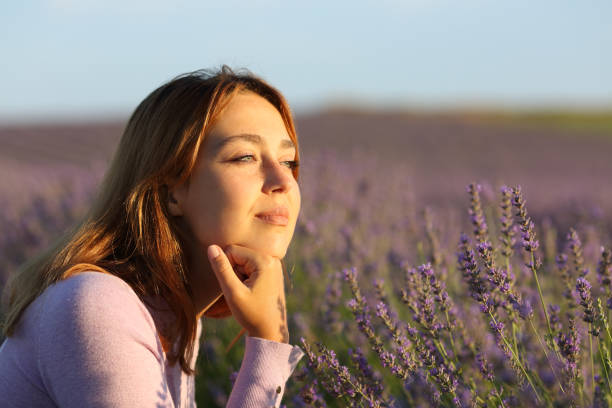 istock Relaxed woman contemplating lavender field 1367864447