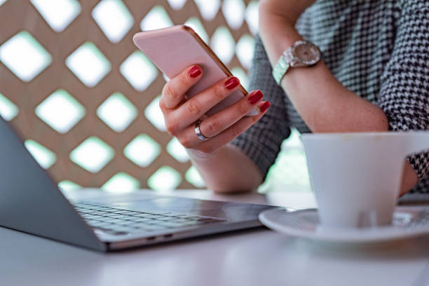 istock Close up of woman using smart phone 1367867302