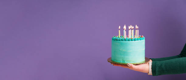 istock Person holding a birthday cake 1367867508