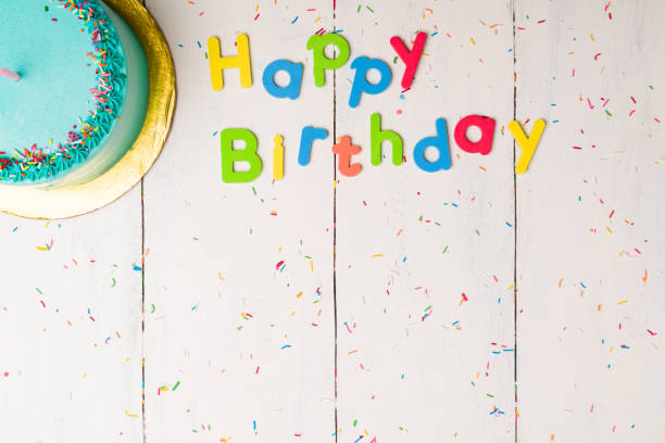 istock Top view of a birthday cake at a party 1367867620