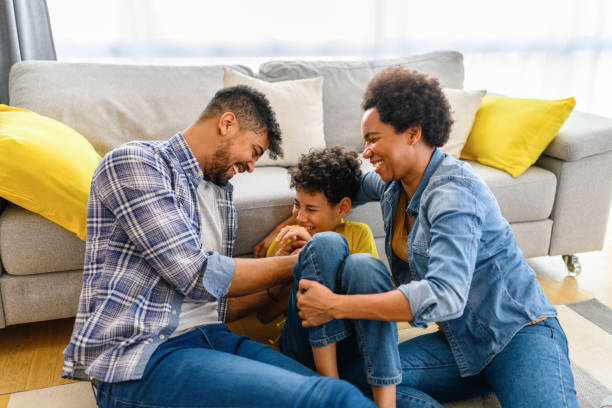 istock Happy black family at home. 1367867773