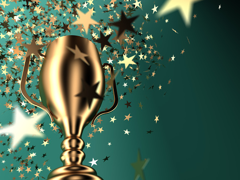 Gold cup and falling stars,copy space Success, competition , sports, and winning concept.