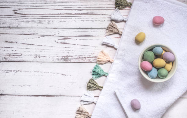 istock Easter chocolate eggs on wooden background, on kitchen cloth, copy space 1367869138