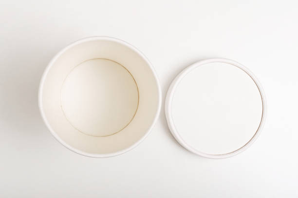White paper cup with lid mockup on white background. Flat lay. Top view