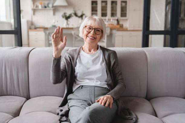 istock Front view. Videocall conference conversation online. Caucasian old elderly senior woman grandmother looking at camera, talking with friends, grandchildren, social distance concept 1367871716