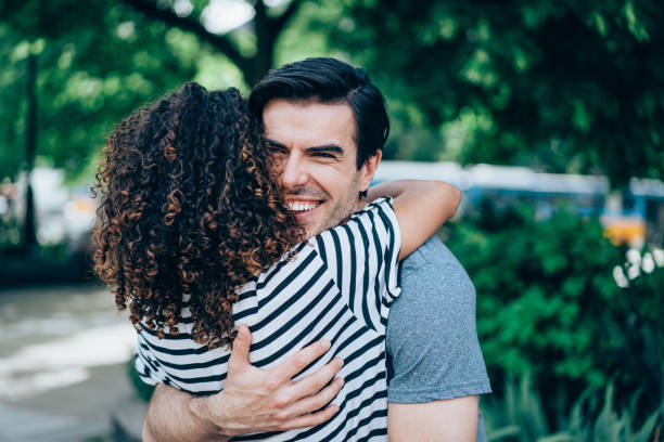 istock Happy couple hugging outdoors. 1367874513