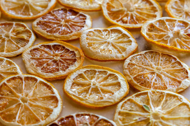 istock Dried oranges and lemons on a marble counter 1367875593