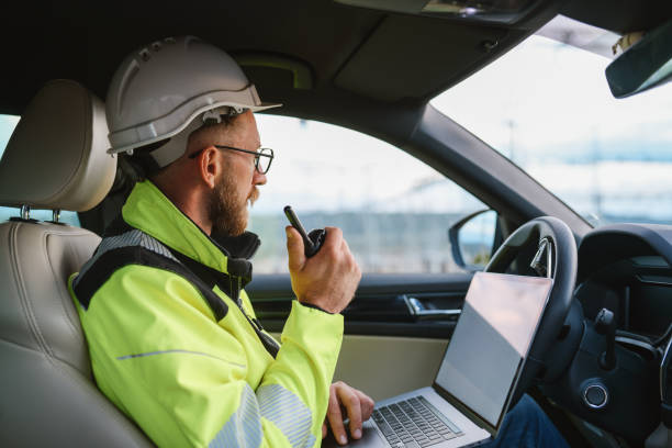 Engineer working from his car. stock photo
