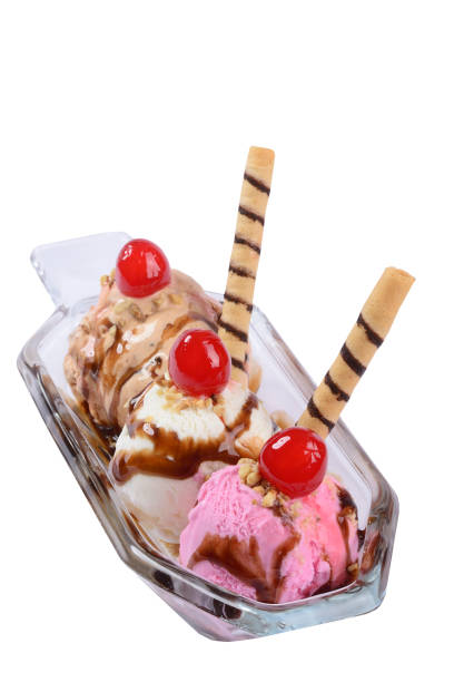 Banana split ice cream in glass bowl on white background. Dessert.