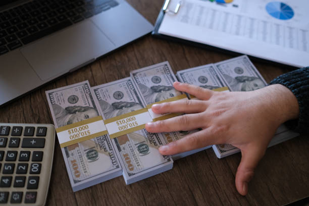 istock Hands holding dollar cash 1367877615