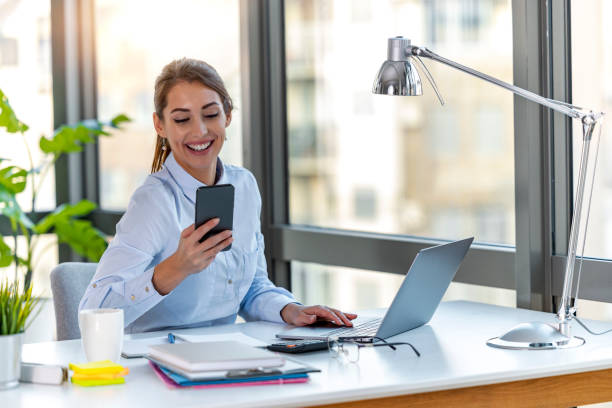 istock Businesswoman in office,using phone 1367877795
