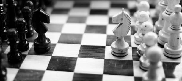 Chess Pieces on a Board for Competition and Winning Success stock photo