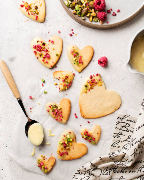 istock Cookie hearts with raspberries. Background for Valentine's Day. Nut cookies. Baking for lovers. 1367879023