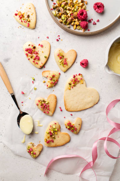 istock Cookie hearts with raspberries. Background for Valentine's Day. Nut cookies. Baking for lovers. 1367879077