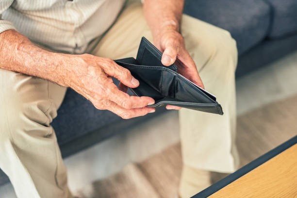 istock Shot of a senior man opening his empty wallet 1367880677