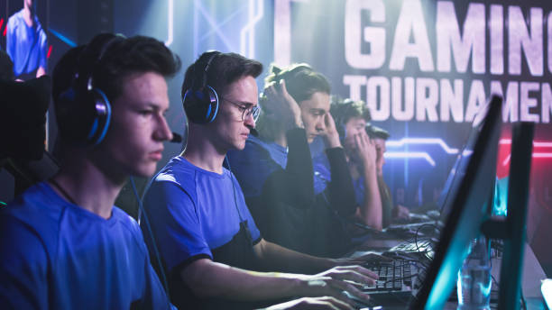 istock Young gamers putting on headphones before match 1367881290