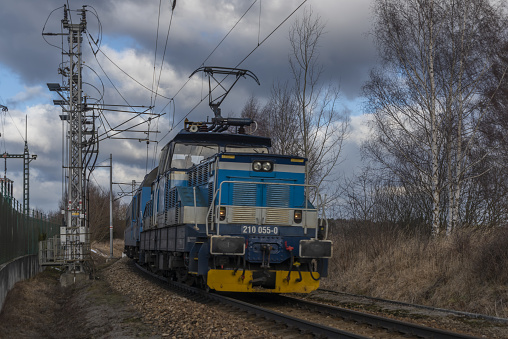Blue passenger Czech old train in Velesin station in winter cold day