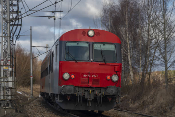 istock Red passenger Austria train in Velesin station in winter day 1367881403