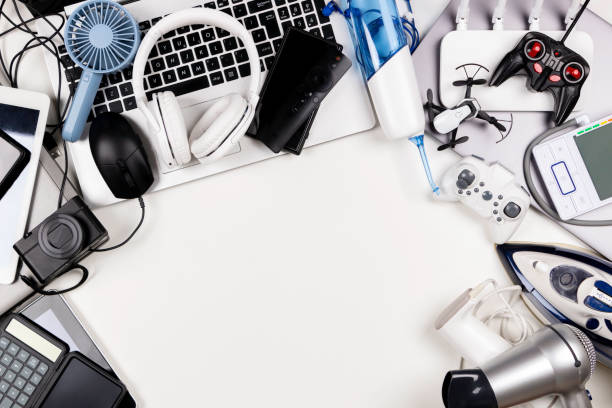 istock Old computers, digital tablets, mobile phones, many used electronic gadgets devices, broken household and appliances on white background. Planned obsolescence, electronic waste for recycling concept 1367882740