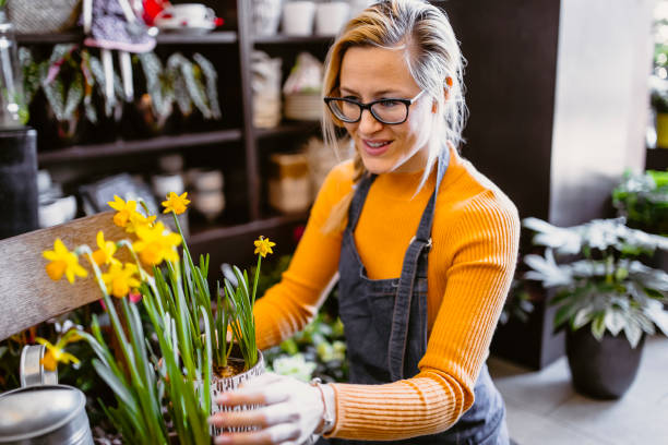 istock Florist working in the flower shop 1367882995