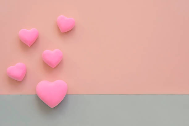 istock 3d pink hearts border frame background. Concept of love, romantic relationship, heart shape symbol, flat lay layout with copy space. Celebration of  wedding, Valentines Day, mothers day. 1367883241