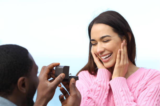 istock Man with black skin proposing marriage 1367884742