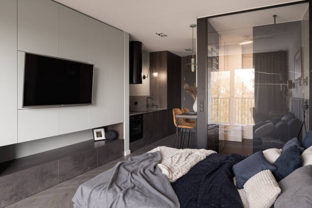 istock Studio apartment with big tv 1367887198