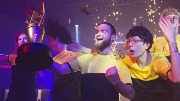 istock Young gamers celebrating victory under confetti 1367889132