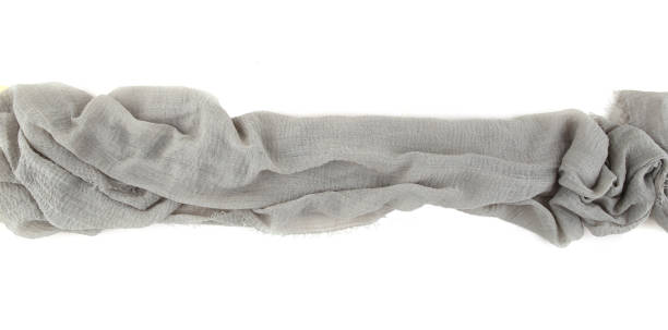 istock Natural cotton gauze table runner or baby shower fabric isolated on white  background. 1367891702